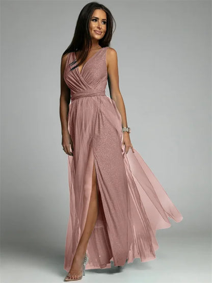 Luxurious women's evening dress with tulle and slit