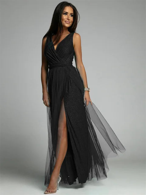 Luxurious women's evening dress with tulle and slit