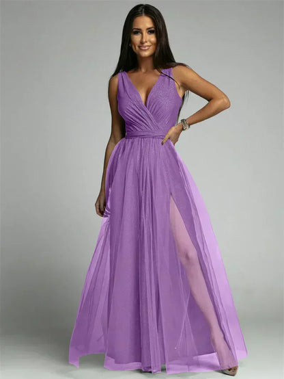 Luxurious women's evening dress with tulle and slit