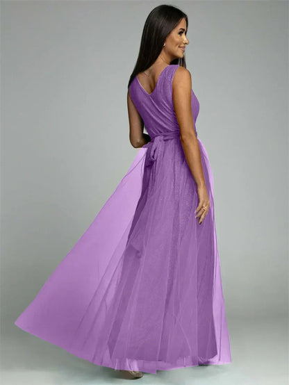 Luxurious women's evening dress with tulle and slit