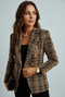 Women's blazer with check pattern and double-breasted button closure