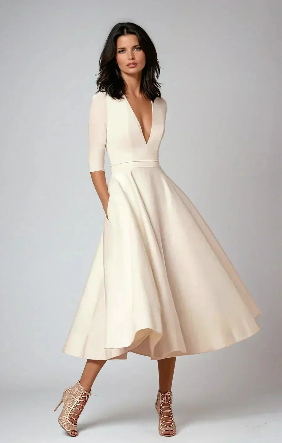 Robe midi évasée col en V, manches 3/4, en tissu lisse, avec poches pratiques, idéale pour un mariage.