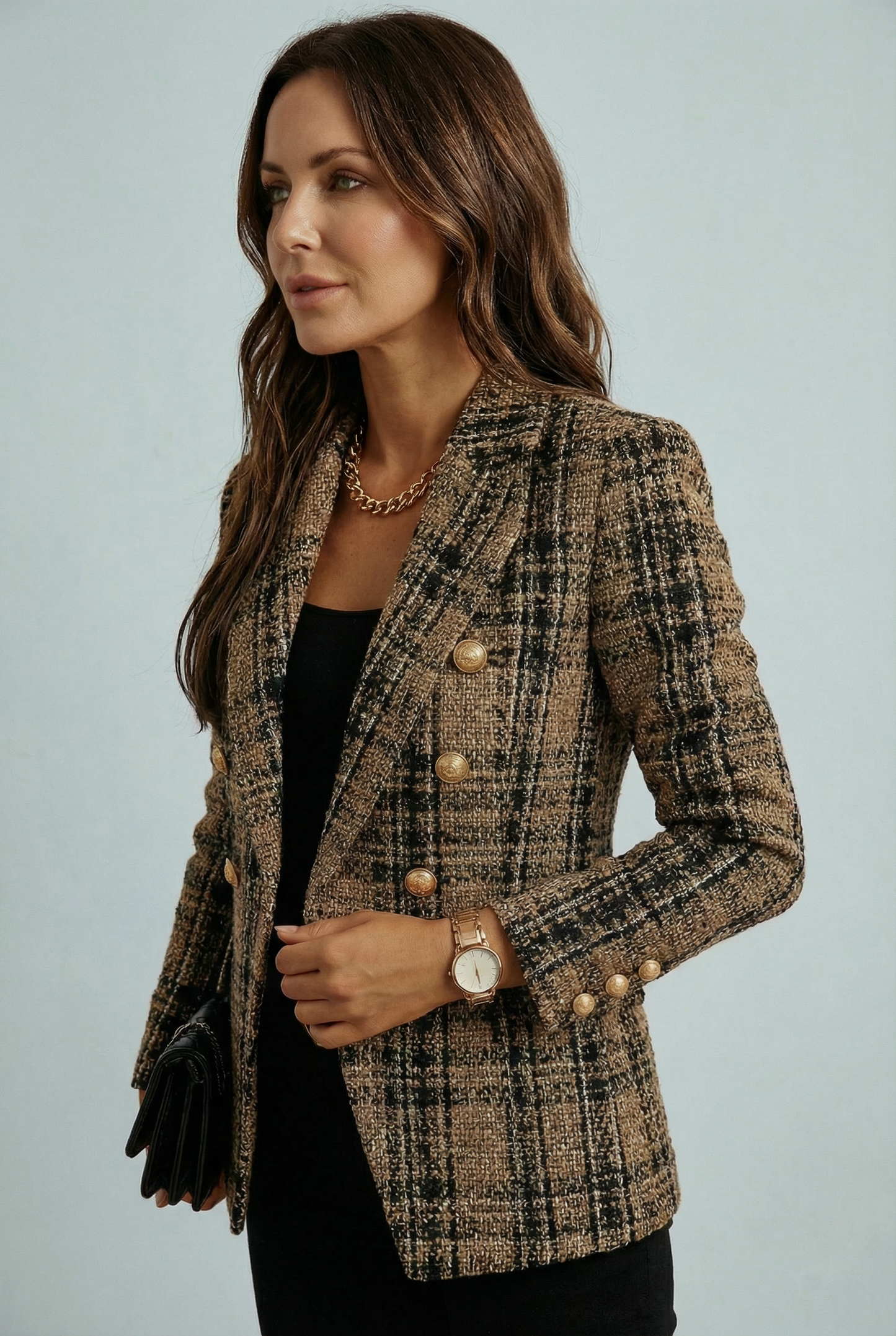 Women's blazer with check pattern and double-breasted button closure